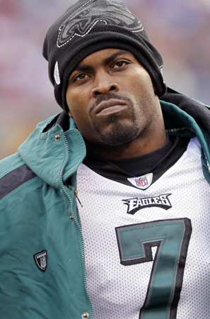 Philadelphia Eagles Michael Vick stands on the sidelines in the