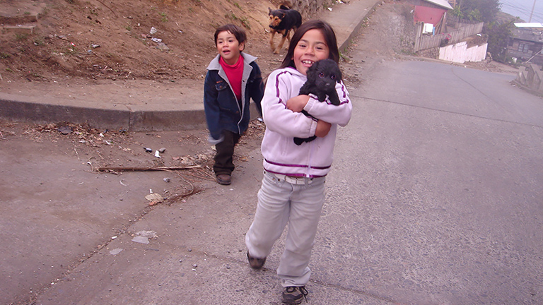 Kids at Lota tent camp with dogs, Kinship Circle